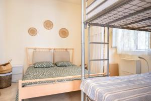 a bedroom with a bunk bed in a room at Villa Serenità in San Vito dei Normanni +29 photos