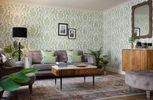 a living room with a couch and a table at The Ashe Hotel in Tralee