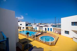 a view of a swimming pool on top of a building at TAO El Cotillo - VV in El Cotillo
