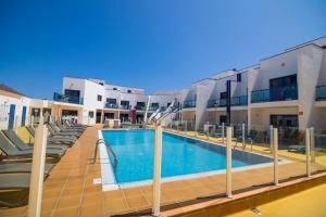 a swimming pool in the middle of a building at TAO El Cotillo - VV in El Cotillo