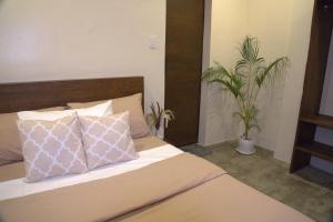 Giường trong phòng chung tại Villa Cila