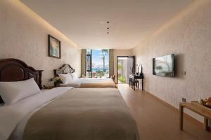 Dali Blue House Sea View B&B客房内的一张或多张床位