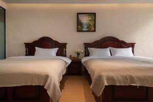 Dali Blue House Sea View B&B客房内的一张或多张床位