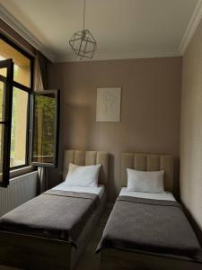 Llit o llits en una habitació de Guest House NIMA