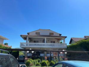 a house with a balcony on top of it at Anthony&Amar in Berat