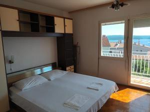 Postel nebo postele na pokoji v ubytování APARTMAN NENO