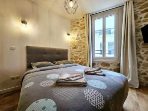 Postel nebo postele na pokoji v ubytování Le Championnet - Proche du Port