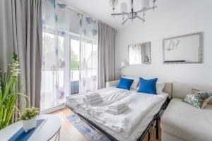 Postel nebo postele na pokoji v ubytování Apartament Sunset Resort 25 SurfingBird Grzybowo