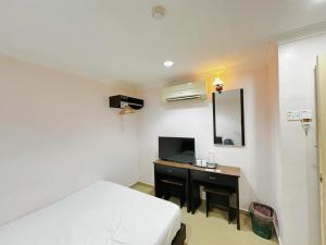 TV a/nebo společenská místnost v ubytování OYO 91150 Hotel Tasik Utama