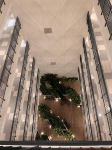 a large building with plants on the ceilings at BRP Luxe Condo with Parking and Wifi in Davao City