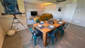 a table with chairs and a camera in a living room at Villa Serenissima in Someraro +24 photos