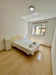 En eller flere senge i et værelse på Apartamento Benicarlo REF 064