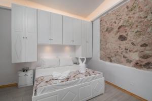 En eller flere senge i et værelse på Aegean View House in Tripiti