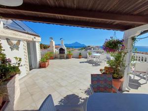 a patio with a view of the ocean at Haus Despina in Sarti