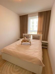 Ένα ή περισσότερα κρεβάτια σε δωμάτιο στο Apartament Beaufort z ogródkiem