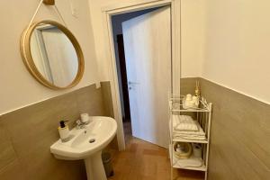 a bathroom with a sink and a mirror at B&B Antica Dimora in Pergola +12 photos