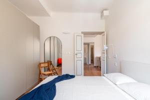 Ένα ή περισσότερα κρεβάτια σε δωμάτιο στο Casa Tigullio