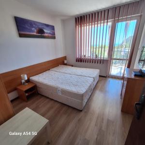 Katil atau katil-katil dalam bilik di Alexa beach apartment