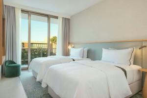 เตียงในห้องที่ The Westin Salgados Beach Resort, Algarve