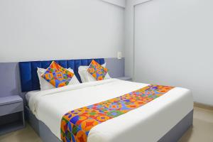 Postel nebo postele na pokoji v ubytování FabHotel Baner Executive - Nr MCF Camp + 27 fotografií