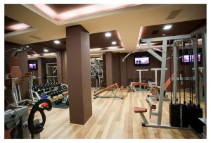 a gym with lots of treadmills and machines at Bendita Mare Golden Sands Bulgaria in Golden Sands