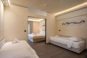A bed or beds in a room at Aiora Resort
