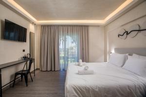A bed or beds in a room at Aiora Resort