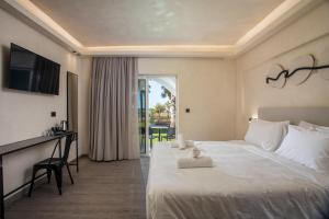A bed or beds in a room at Aiora Resort