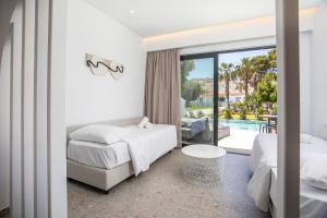 A bed or beds in a room at Aiora Resort