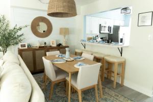 a kitchen and dining room with a table and chairs at 114 Austin Ave, Unit 11 in Wildwood