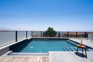 a swimming pool on the roof of a house at חופש יהונתן-וילה חלמונית יוקרתית עם נוף לכנרת Hofesh Yehonatan Villa in Tiberias