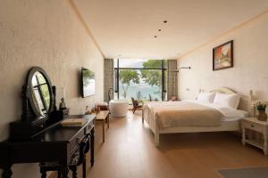 Dali Blue House Sea View B&B客房内的一张或多张床位