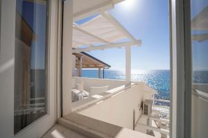 a balcony with a view of the ocean at I Gradini sul Mare in Santa Maria