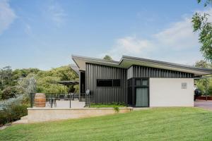 a house with a large white garage at Wildwood Retreat a Luxury Vineyard Escape in Yallingup Siding