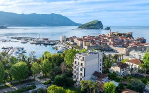 an aerial view of a town next to a body of water at Hotel Majestic in Budva