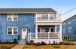 a blue house with a white balcony at 307 E Crocus Rd, Unit B in Wildwood Crest