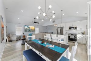 a kitchen and living room with a table and chairs at 225 E Youngs Ave, Unit A in Wildwood
