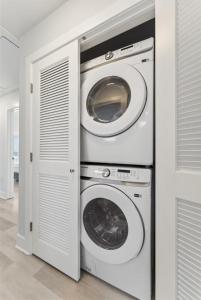 a laundry room with two washer and dryer at 225 E Youngs Ave, Unit A in Wildwood