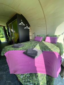 a bedroom with a large bed in a tent at Eco-lodge, slow living by nature in Krim