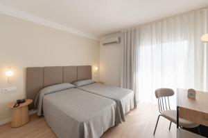 Postel nebo postele na pokoji v ubytování Hotel RH Sol