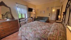 Ένα ή περισσότερα κρεβάτια σε δωμάτιο στο Agriturismo Cascina Tollu