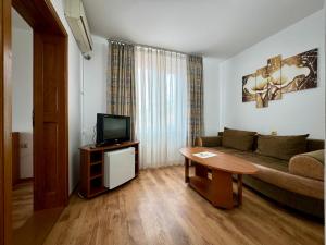 TV a/nebo společenská místnost v ubytování Mellys Haus