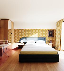 a bedroom with a large bed in a room at Artcore Hotel Porto in Porto +12 photos