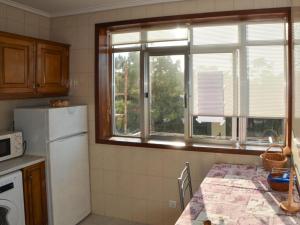 Η κουζίνα ή μικρή κουζίνα στο Apartamento acolherdor +8 φωτογραφίες