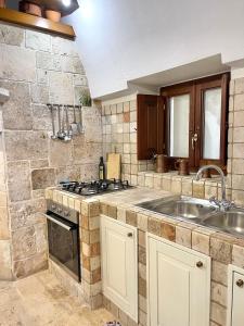 A kitchen or kitchenette at Masseria Lacatena