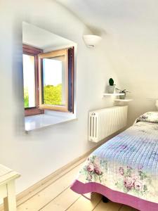 A bed or beds in a room at Masseria Lacatena