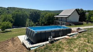 a swimming pool in the yard of a house at Uba Fruška gora in Velika Remeta