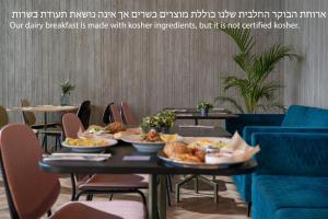 a table with plates of food on top of it at Stay Eilat in Eilat
