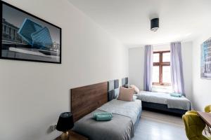 Posteľ alebo postele v izbe v ubytovaní Cooltour Hostel