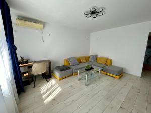 a living room with a couch and a table at Sea & Stay in Constanţa
